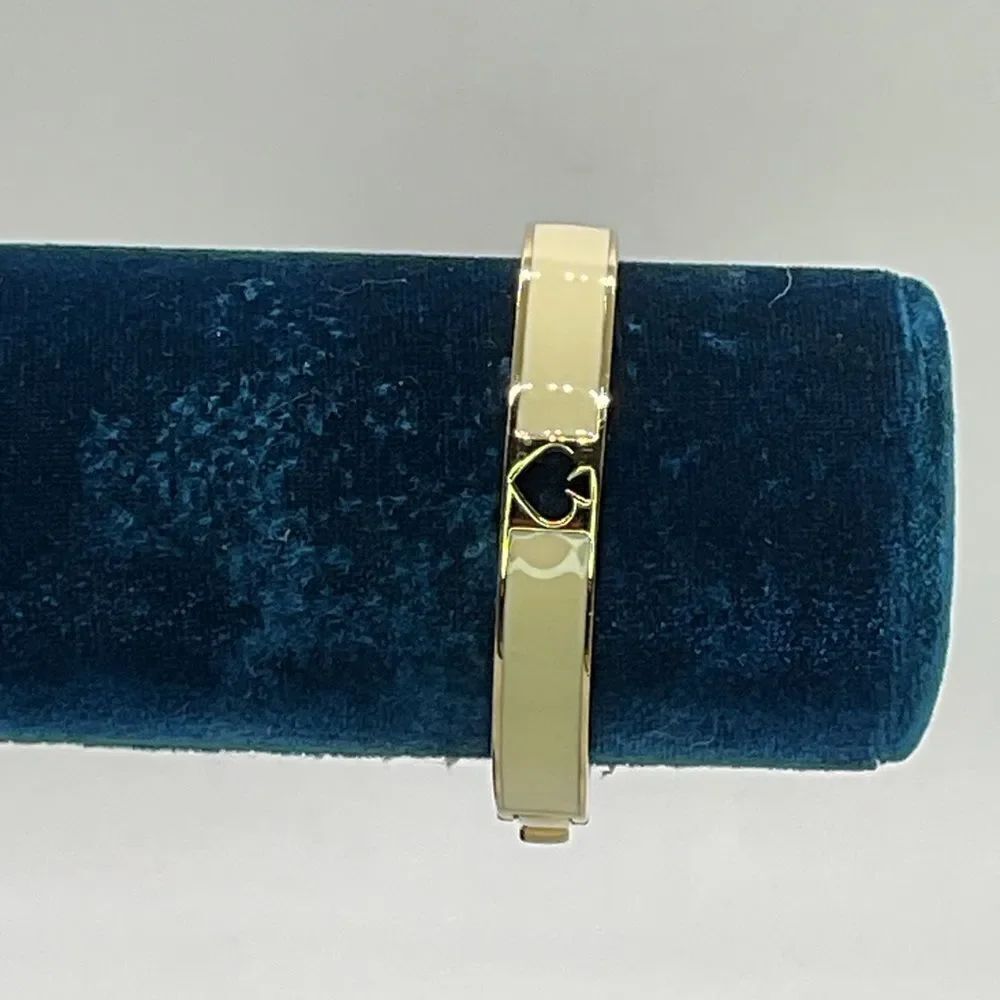 Kate Spade Gold Tone and Cream Hinged Bangle Bracelet